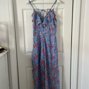 Light blue jumpsuit in floral prints, size small.